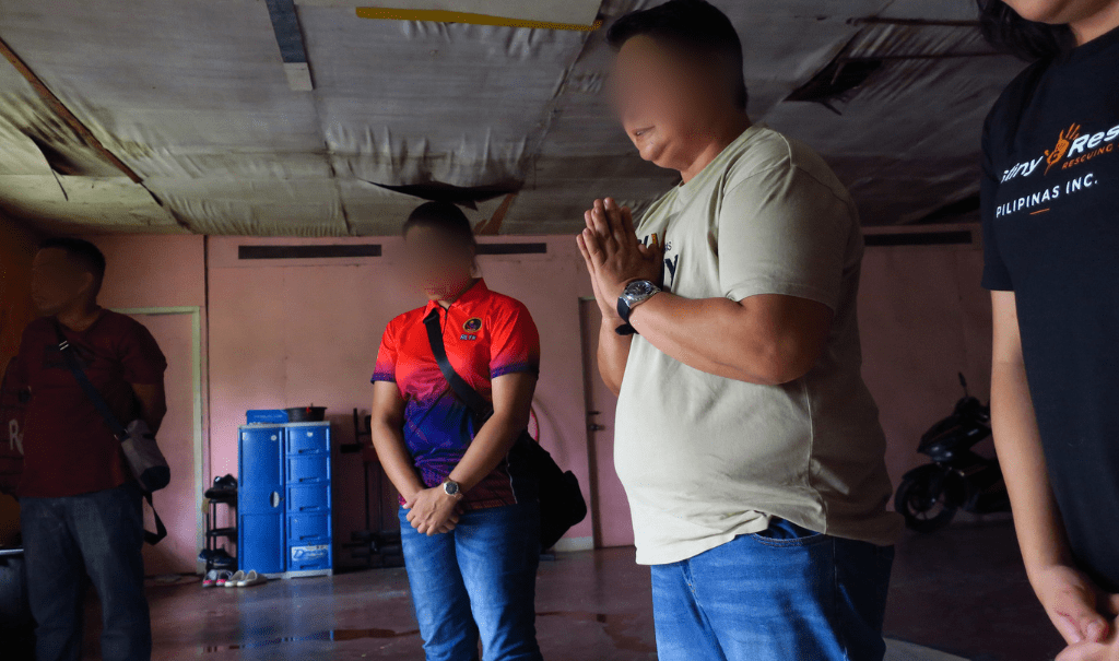 A prayer held before a raid in the Philippines