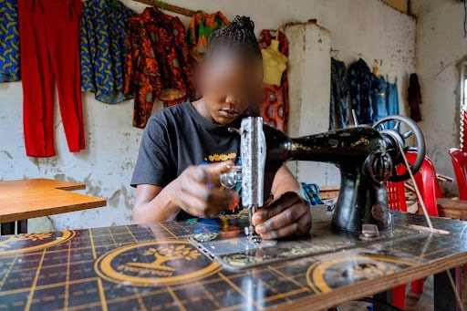 Access to education is widely recognised as the most significant factor in delaying the age of marriage for girls (Image: A trafficking survivor in Uganda receives tailoring training)